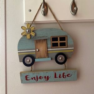 Hanging “Enjoy Life” wood/metal camper sign